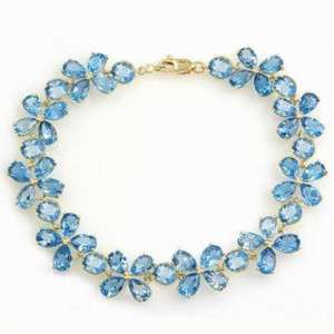   Yellow Gold Tennis Bracelet with Natural Blue Topaz Gemstone Flowers