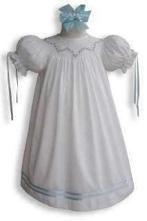 This lovely heirloom quality portrait girls dress is hand smocked and 