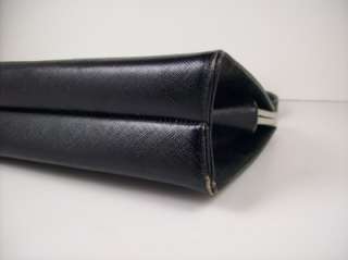 This wonderful little handbag purse has a pretty silver tone closure 