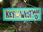 key west mile 0 tropical tiki hut pool beach sign
