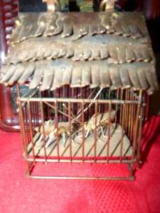seen many little brass cages but a little brass cage with two cricket 