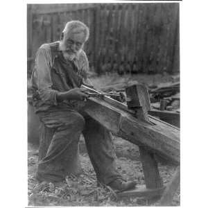  Old man using draw knife,c1930,photoprint by Doris Ulmann 